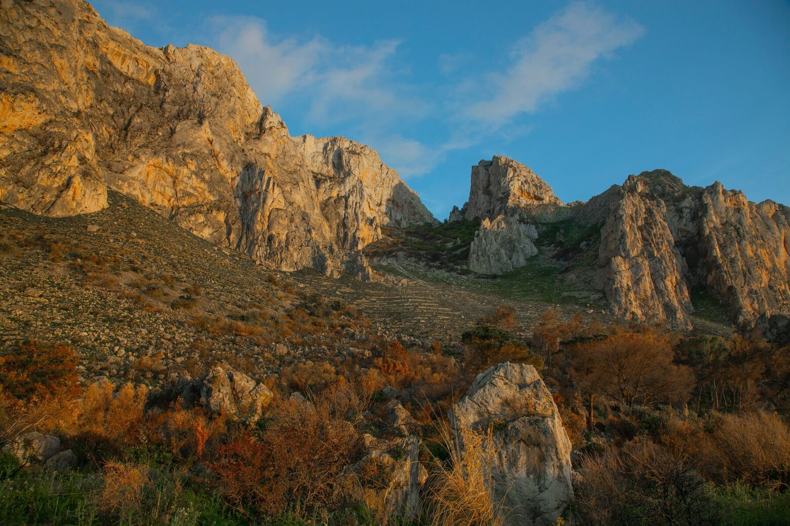 The limestone interior at dusk, the country behind the honorific title.